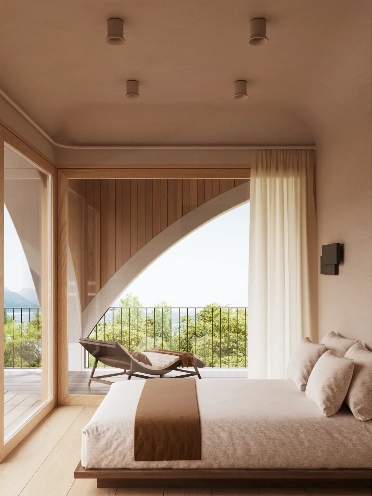 A bedroom under an arch, with the terrace beyond