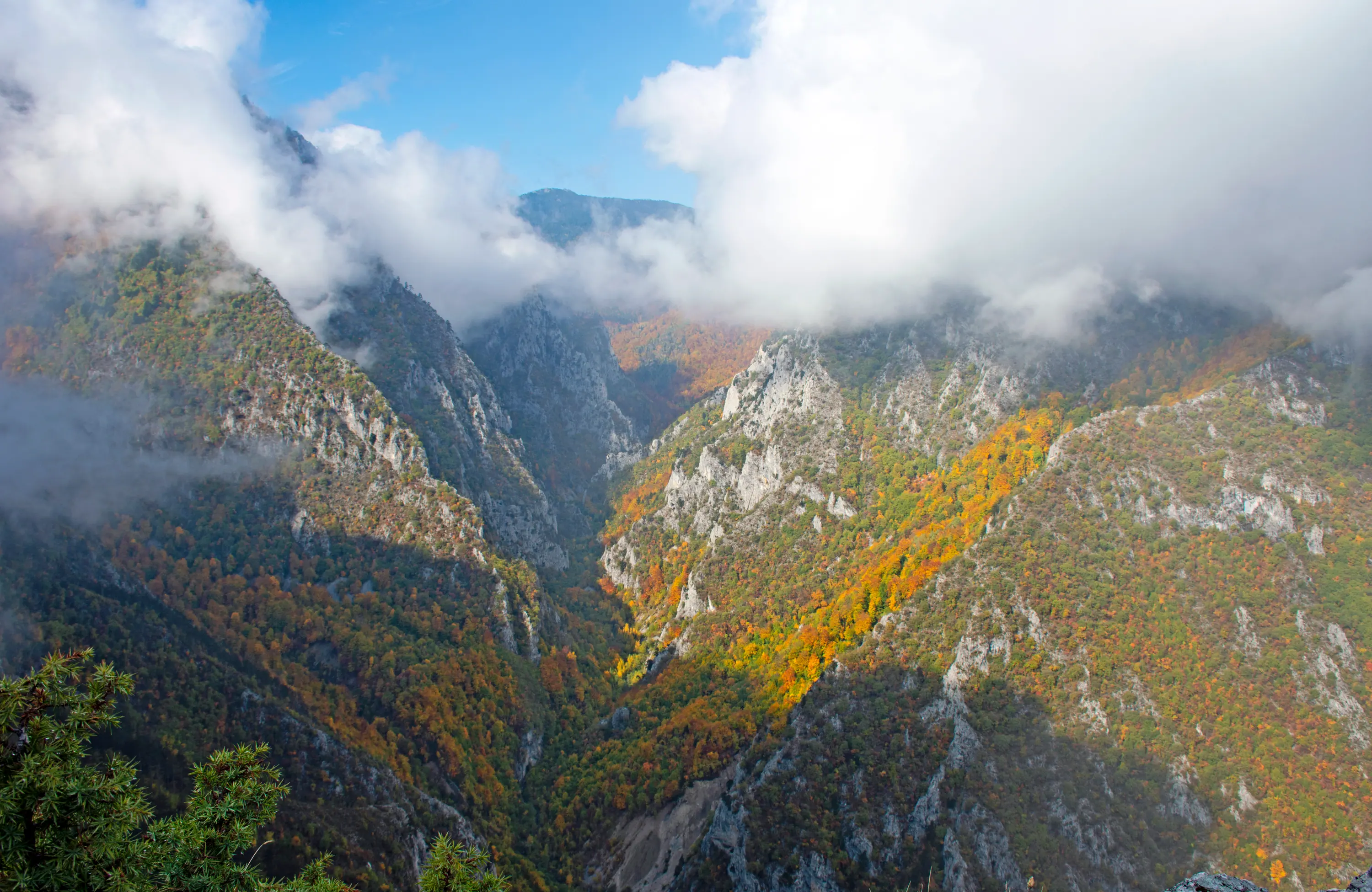 Autumn in the Rugova gorge above Peja, clouds on the peaks